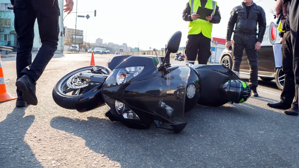 Police men assessing the damages after a motorcycle accident in Bronx, NY