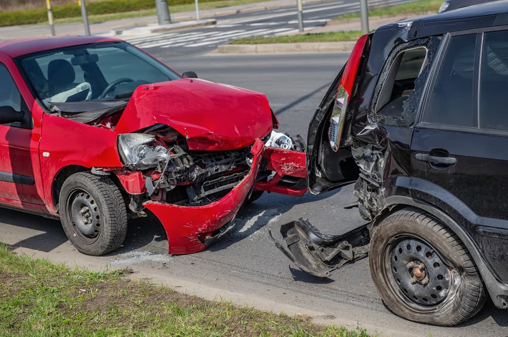 Car crash accident on street, damaged automobiles after rear-end collision in city