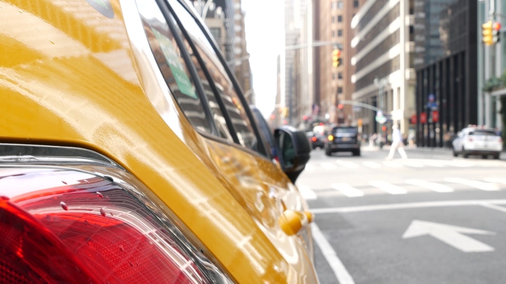 Yellow taxi involved in a traffic accident at a New York City intersection